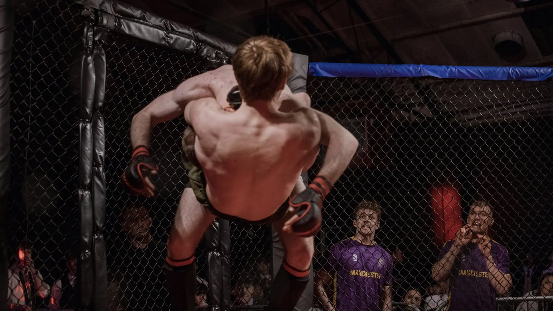 A society fighter in the cage on fight night
