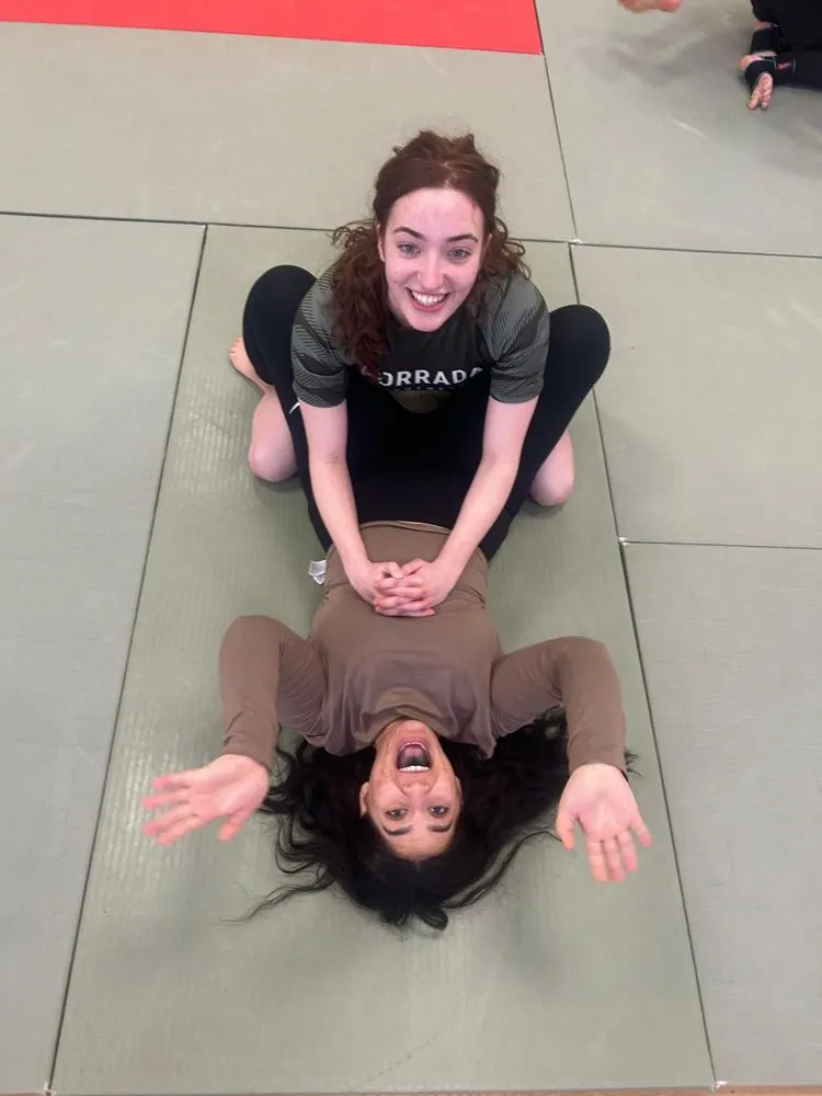 Two members on the mats after training